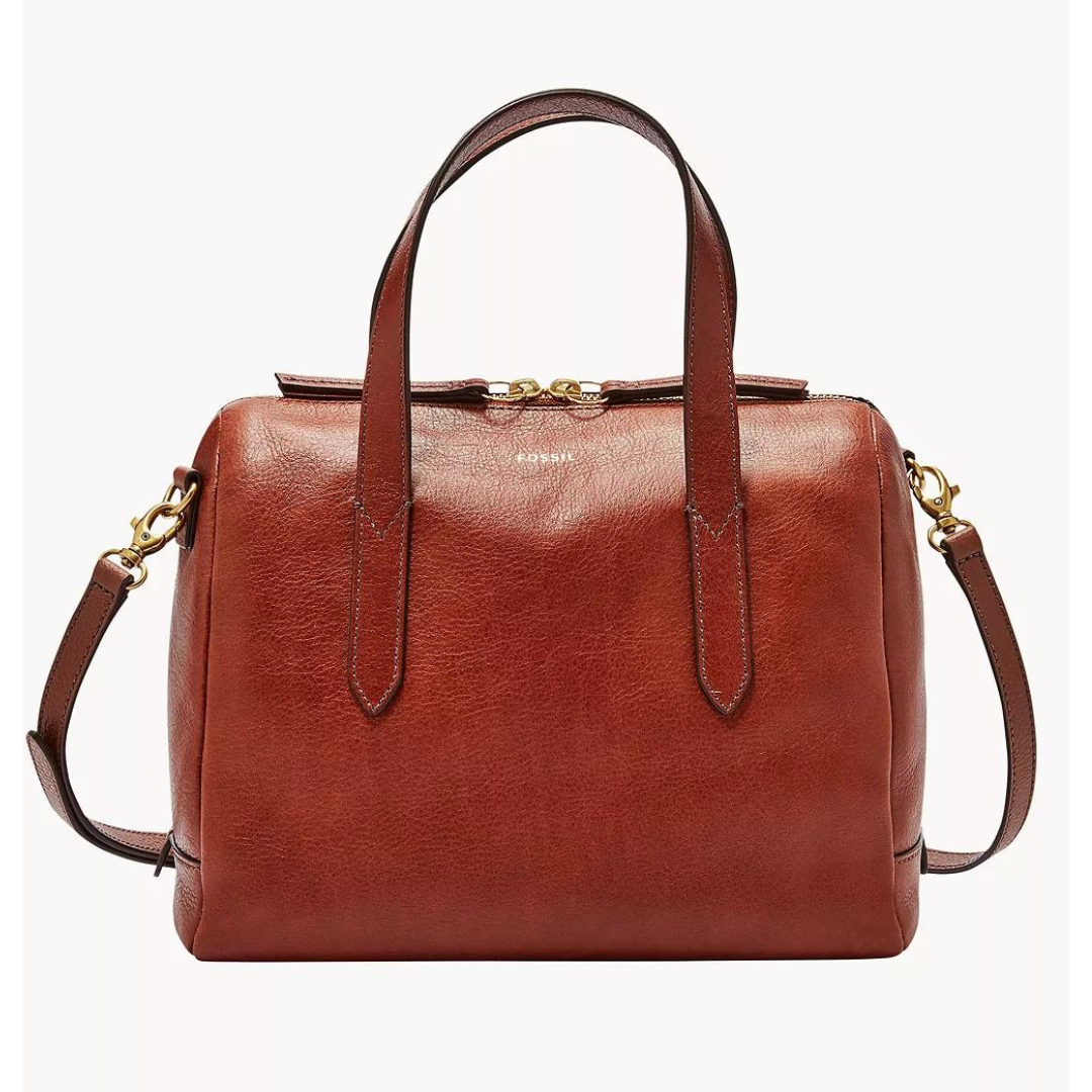 A Fossil Sydney Satchel in brown leather, featuring a zip top closure, double handles, a detachable shoulder strap, and gold-tone hardware.