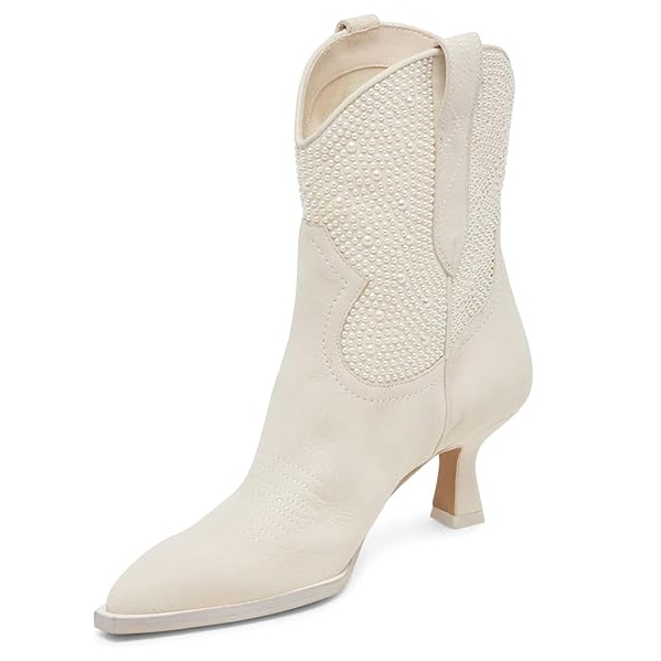 A white ankle boot with a pointed toe and a low heel, featuring decorative pearl embellishments on the upper part and pull tabs.