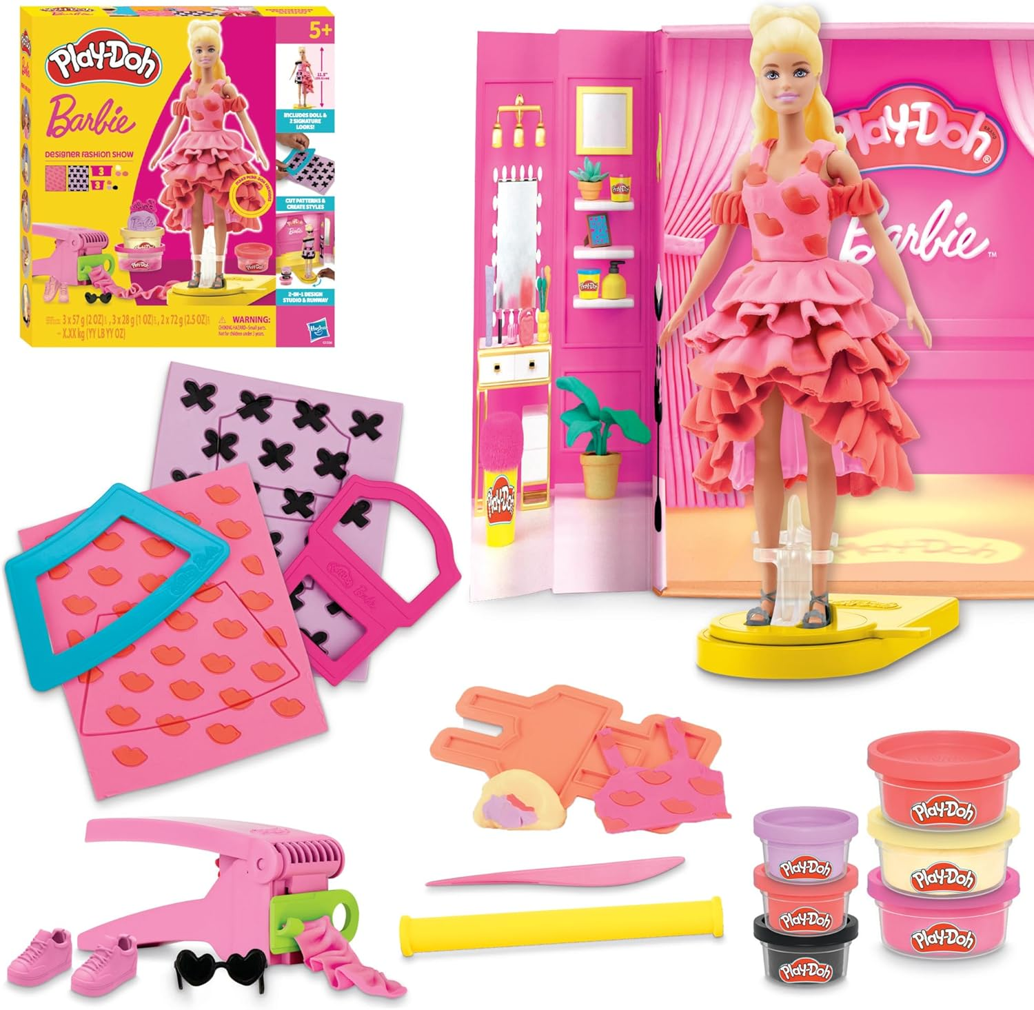 Play-Doh Barbie Designer Fashion Show set includes a Barbie doll, molds, tools, and Play-Doh cans for creating and styling dresses and accessories.
