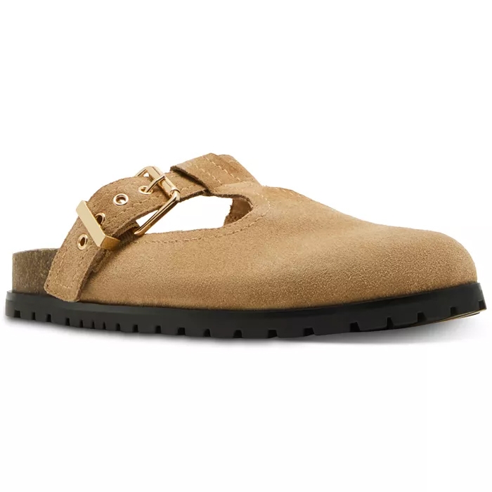 A tan suede clog with a gold buckle, featuring a T-strap design and a black rubber sole for added grip.