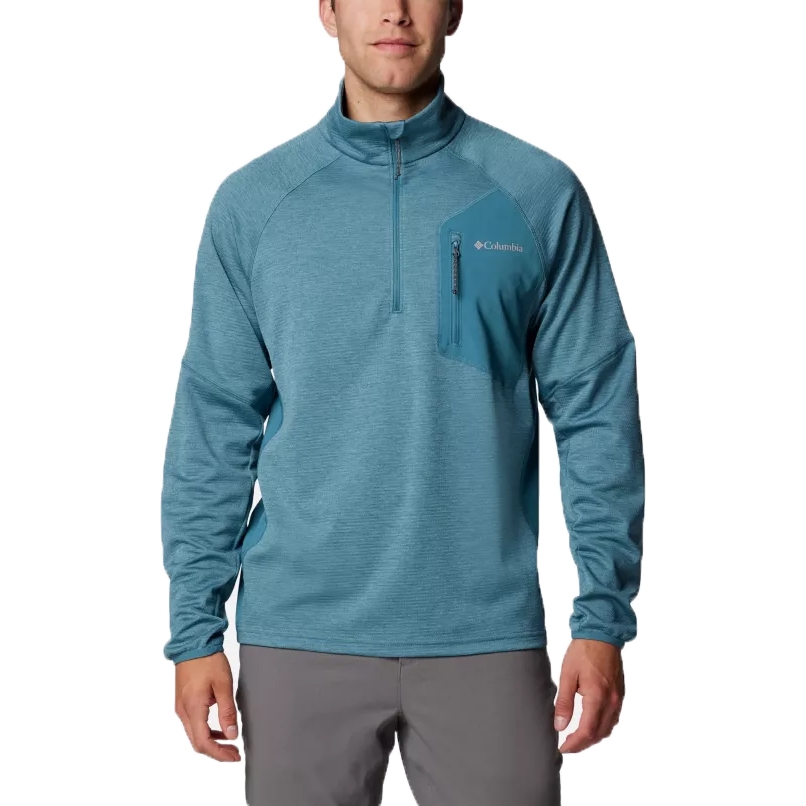 A man wearing a blue half-zip Columbia pullover with a chest pocket.