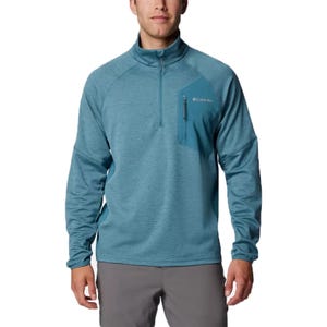 A man wearing a blue half-zip Columbia pullover with a chest pocket.