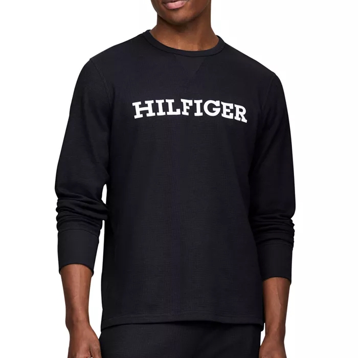 A black thermal shirt with long sleeves featuring the word \“HILFIGER\“ in bold white letters across the chest.