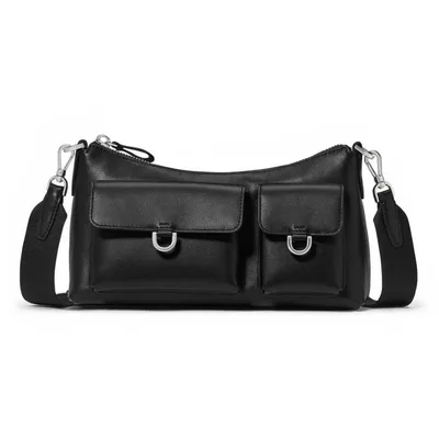 A black leather crossbody bag with two front flap pockets, featuring silver hardware and an adjustable strap.
