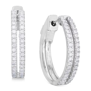 A pair of silver hoop earrings encrusted with small round diamonds along the outer edge.