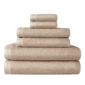 A set of beige towels in various sizes is neatly stacked, ranging from small hand towels to larger bath towels.