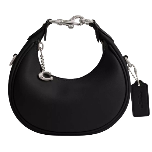 A black crescent-shaped handbag featuring silver hardware, a chain strap, and a small tag.