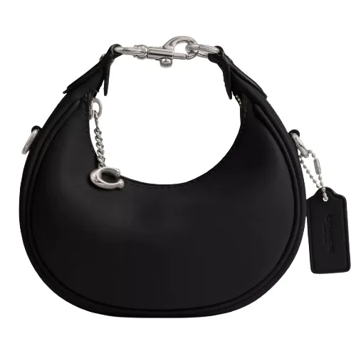 A black crescent-shaped handbag featuring silver hardware, a chain strap, and a small tag.