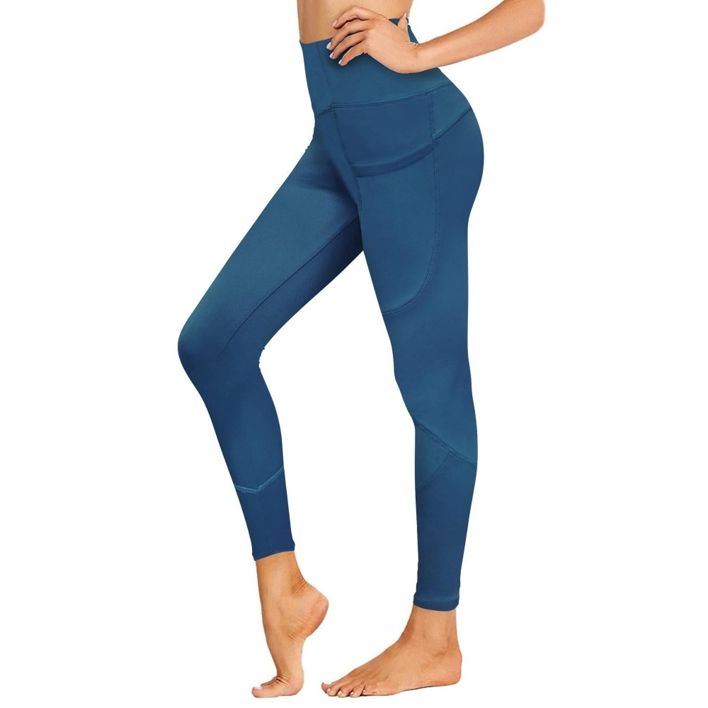Blue high-waisted leggings featuring side pockets, designed to fit snugly against the body, with a seamless construction and a full-length design.
