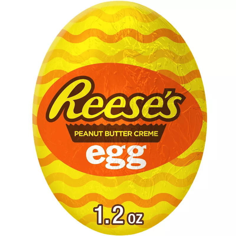 Reese's Peanut Butter Creme Egg, 1.2 oz, with a yellow and orange wrapper featuring zigzag patterns.