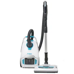 A Simplicity canister vacuum cleaner with a white and teal design, featuring a flexible hose and an adjustable wand with a floor nozzle attachment.