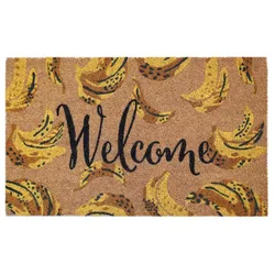 A doormat with the word \“Welcome\“ in black script and a pattern of yellow and black bananas on a tan background.