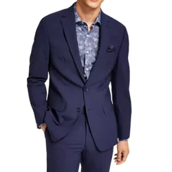 A man is wearing a navy suit with a patterned blue shirt underneath, complemented by a pocket square.