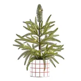 A small artificial Christmas tree with green pine needles in a pot with a red grid pattern, featuring subtle integrated lights, suitable for indoor holiday decor.