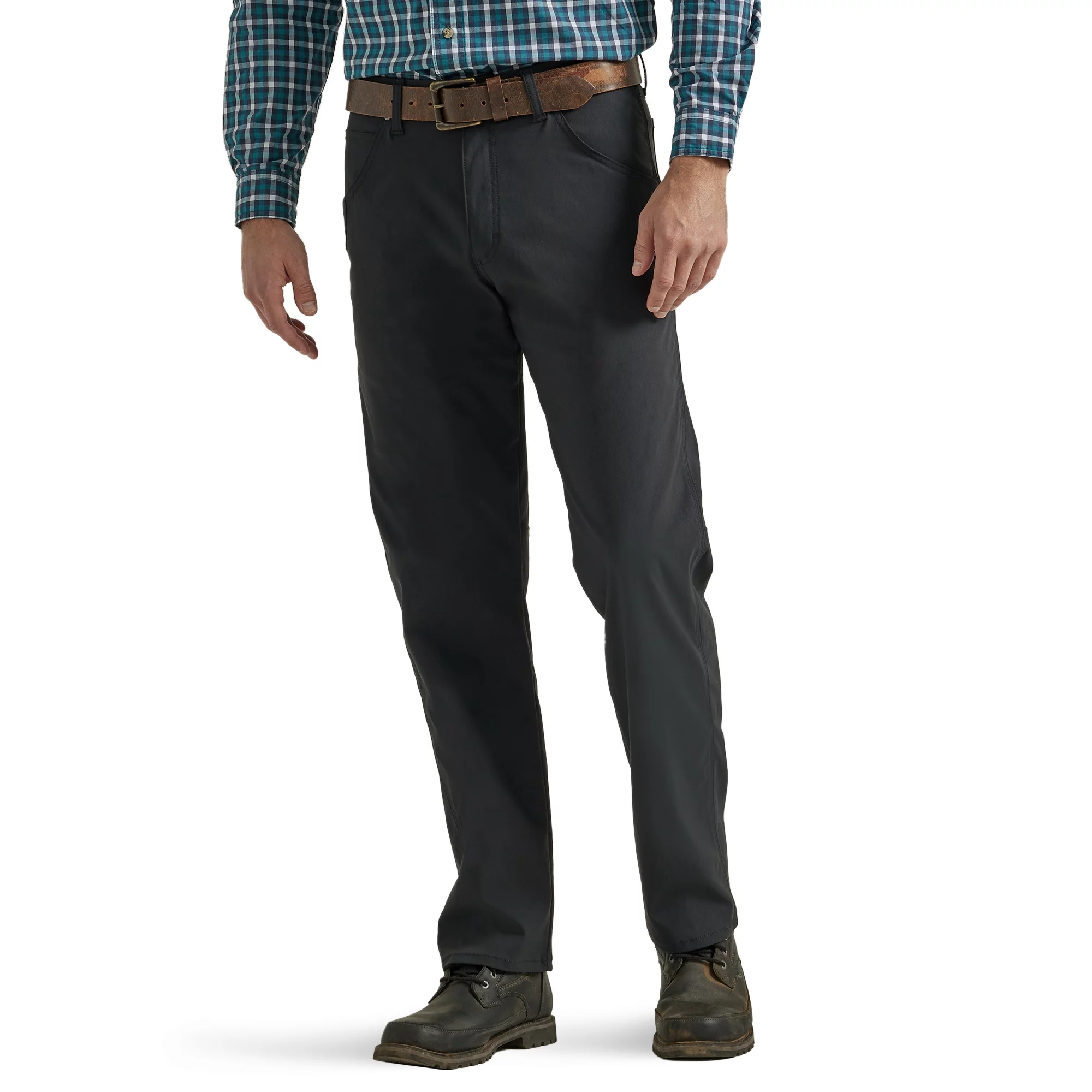 A man wearing black trousers, a plaid shirt, a brown belt, and brown boots.