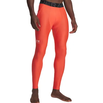Bright orange Under Armour compression leggings for men with a black waistband and brand logo on the thigh.