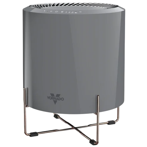 A Vornado air purifier with a sleek, cylindrical design and a stand for elevation, featuring touch controls on the top panel.