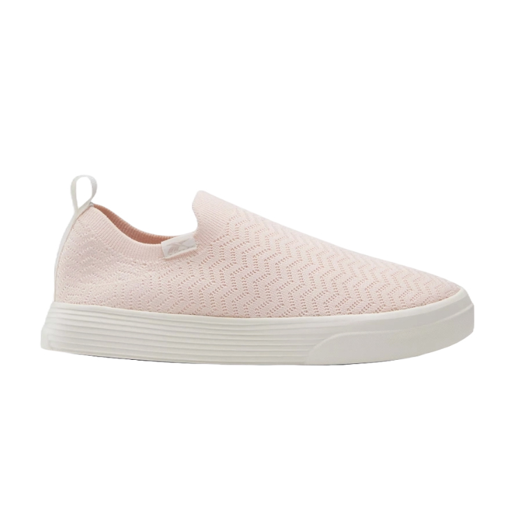 A single pink slip-on sneaker with white sole and a loop at the back on white background.