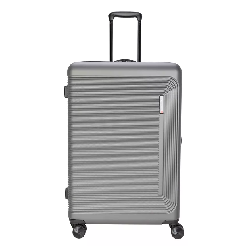A grey, hard-shell suitcase with four wheels and a telescopic handle, featuring a grooved texture.