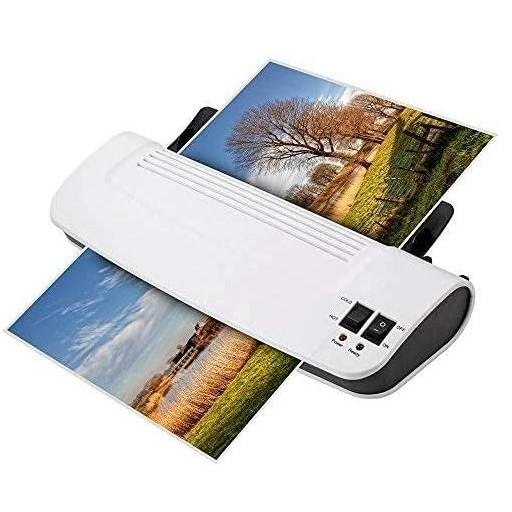 A photo laminator with printed laminated pictures coming out.