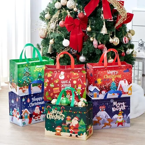Festive gift bags with Christmas-themed designs, featuring Santa, reindeer, Christmas trees, and seasonal greetings, are arranged around a decorated Christmas tree.