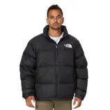 Man wearing a black The North Face puffer jacket with a front zipper, featuring logo embroidery on the upper front.