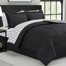 A modern bedding set featuring a black comforter with a subtle stitched design, paired with pillowcases and sheets in matching black and contrasting striped fabric.