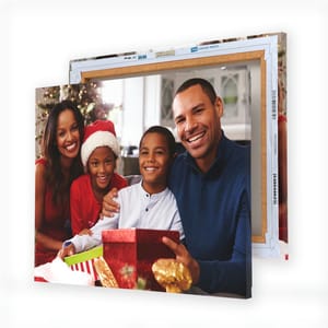 Custom canvases showcasing a smiling family during the holidays, printed on sturdy frames, with free shipping available.