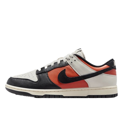 Nike Dunk Low Retro features a black, orange, and white leather upper with a black Swoosh, cream midsole, and black outsole, offering a classic low-cut silhouette with a modern colorway.