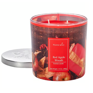 Homewick Red Apple Wreath scented candle, net weight 14 oz (396g), with a decorative holiday-themed design and a silver lid.