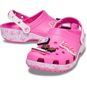 Bright pink Crocs featuring a Barbie-themed design with decorative charms and a patterned sole.