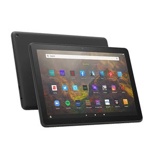 Two Amazon Fire HD 10 Tablets are shown, featuring a 10.1-inch screen with various app icons like Netflix, Facebook, and Hulu on the display. They're in black with a sleek design and a front-facing camera.