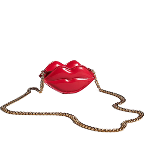 A red, lips-shaped mini crossbody bag with a shiny finish features a gold chain strap.