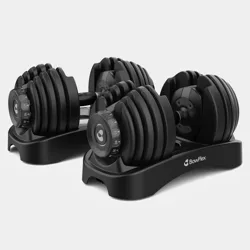 Two adjustable dumbbells with a black design, featuring weight selection dials and resting on a compact stand.