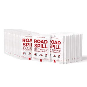 A bulk pack of \“Road Spill On-The-Go Stain Removal\“ wipes is displayed, with red and white packaging highlighting their use for stain removal.
