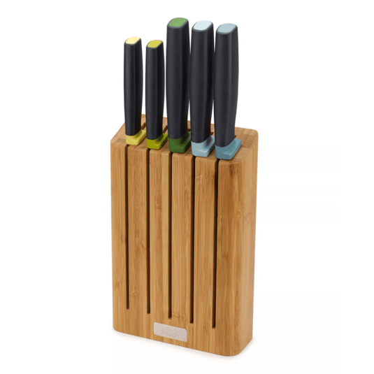A knife set with five knives, each featuring a black handle and a color-coded end for easy identification, placed in a bamboo knife block.