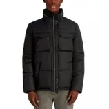 Black quilted down jacket with high collar, front zipper, chest pockets, and side pockets, paired with gray jeans.