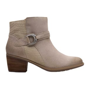 A beige ankle boot with a textured pattern and strap detail featuring a metallic buckle, complemented by a wooden block heel.