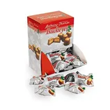 Box of individually wrapped Anthony Thomas Buckeyes, featuring chocolate and peanut butter candies, with some unwrapped pieces in front.