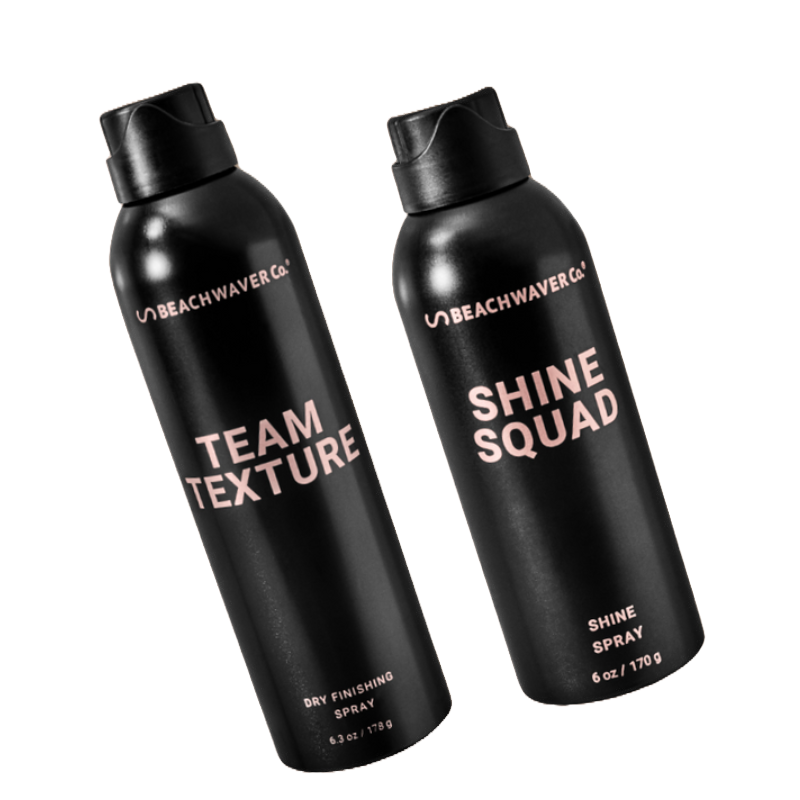 Beachwaver Co. hair products: \“Team Texture\“ dry finishing spray (6.3 oz/179 g) and \“Shine Squad\“ shine spray (6 oz/170 g), both in black aerosol cans.