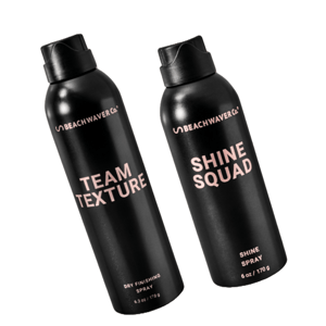 Beachwaver Co. hair products: \“Team Texture\“ dry finishing spray (6.3 oz/179 g) and \“Shine Squad\“ shine spray (6 oz/170 g), both in black aerosol cans.