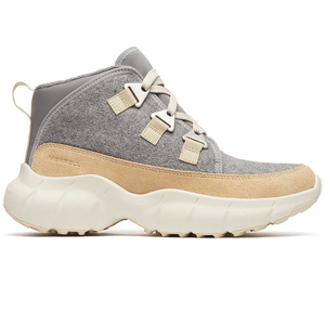 A gray and beige mid-cut sneaker with a chunky white sole, featuring a suede overlay, lace-up design, and pull tab at the heel.