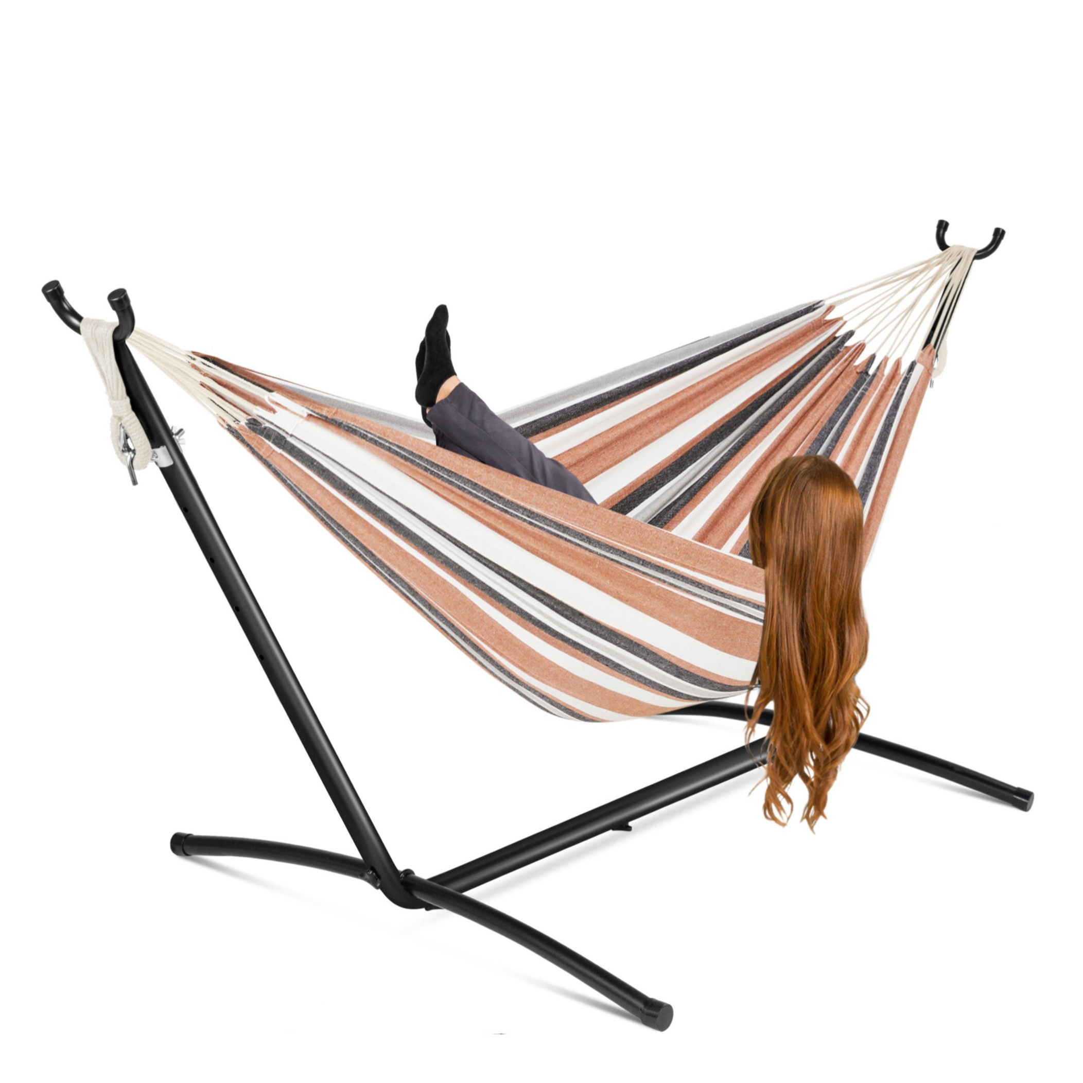 Hammock with a stand featuring a striped design in brown, white, and gray, supporting a person lying down. Includes a black carrying bag with assembly instructions.