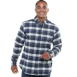 A man wears a blue and white plaid flannel shirt, featuring long sleeves and a button-up front.