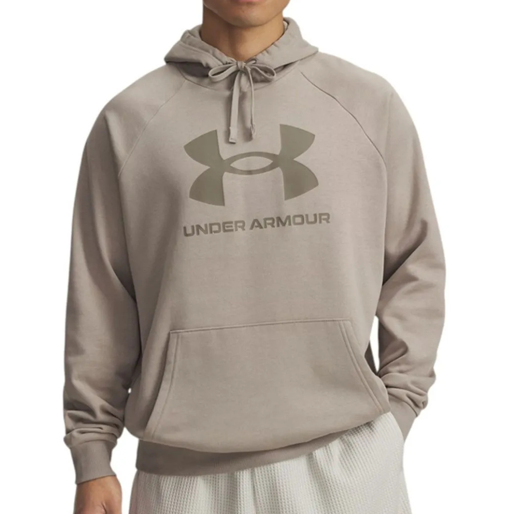 A person is wearing a light gray Under Armour hoodie with a front pouch pocket and a drawstring hood, featuring the brand's logo and name on the chest.