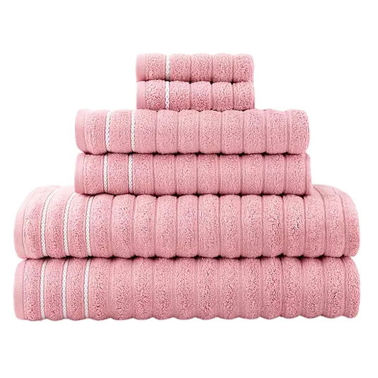 A stack of pink towels in various sizes, featuring a textured pattern with white stripes.