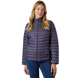 A woman is wearing a purple, quilted, zip-up puffer jacket paired with blue jeans.