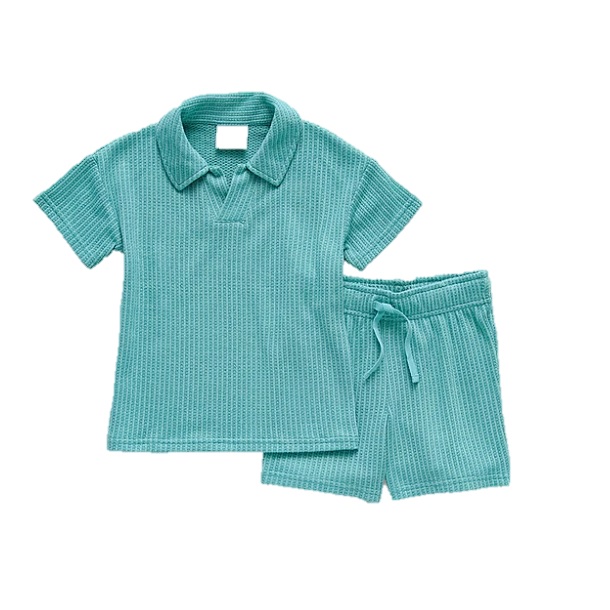 A turquoise waffle-textured short-sleeve shirt paired with matching drawstring shorts.