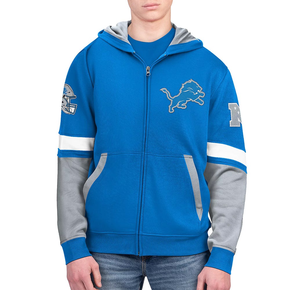 A blue and gray zip-up hoodie featuring a roaring lion logo and an \“NFC\“ patch, typically associated with the Detroit Lions football team.
