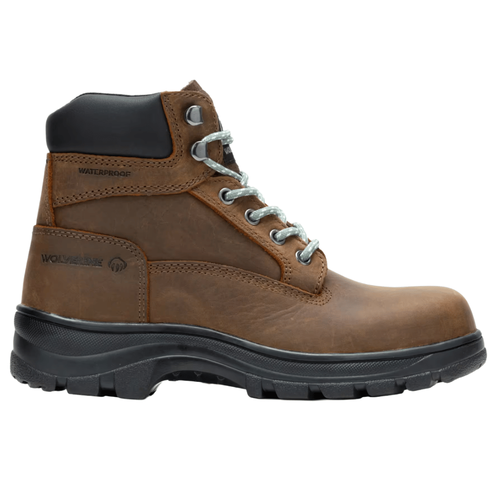 A brown waterproof work boot with a black padded collar, robust treaded sole, lace-up design, and branding on the side.
